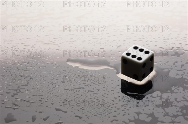Dice on a wet surface