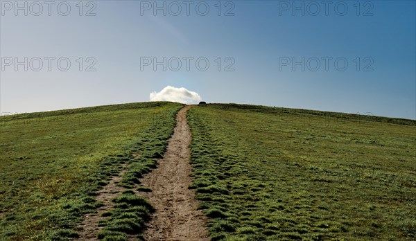 Walk to the top of the greened old landfill site in Grossziethen