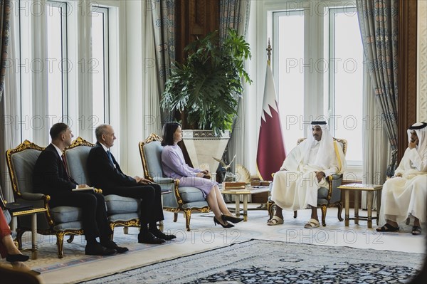 (L-R) Annalena Baerbock (Buendnis 90 Die Gruenen), Federal Minister for Foreign Affairs, and Sheikh Tamim bin Hamad bin Khalifa Al Thani, Emir of the State of Qatar, photographed during a joint meeting in Doha, 17 May 2023. Baerbock is travelling to Saudi Arabia and Qatar on her three-day trip., Doha, Qatar, Asia