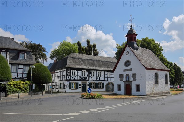 Lady Chapel on a traffic island with half-timbered house
