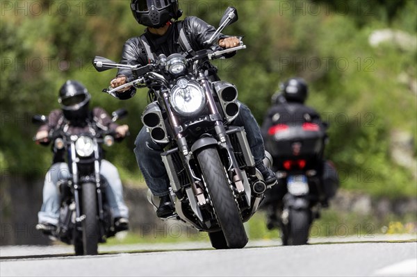 Motorbike on the winding Nufenen Pass in the Alps