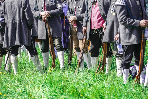 Mountain riflemen gather at the patron saint's day in a meadow near Gmund am Tegernsee