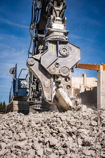 Excavator on demolition site