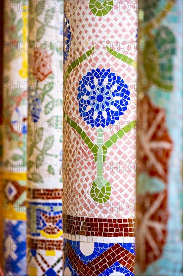 Columns with colourful mosaic on the outdoor terrace