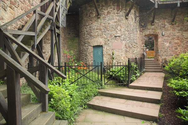 Thieves' tower with city wall and wooden staircase