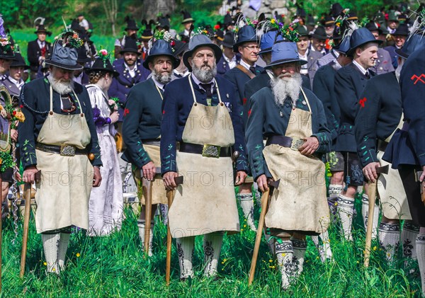 Mountain riflemen gather at the patron saint's day in a meadow near Gmund am Tegernsee