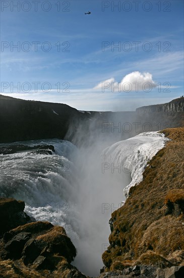 Helicopter over the Gullfoss waterfall in the south of Iceland