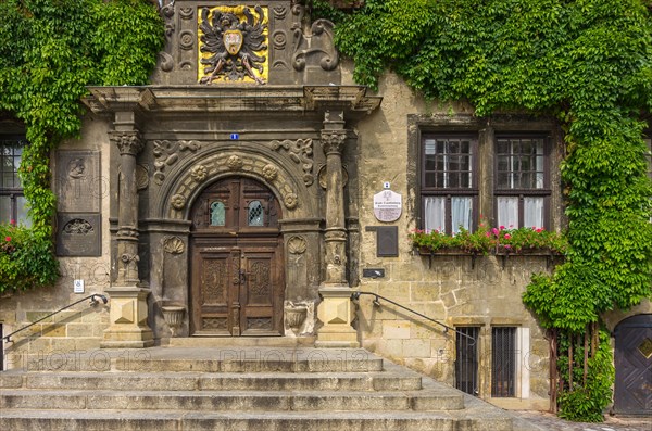 Main portal of the Gothic town hall from the beginning of the 14th century on the market square in the historic old town of the World Heritage city