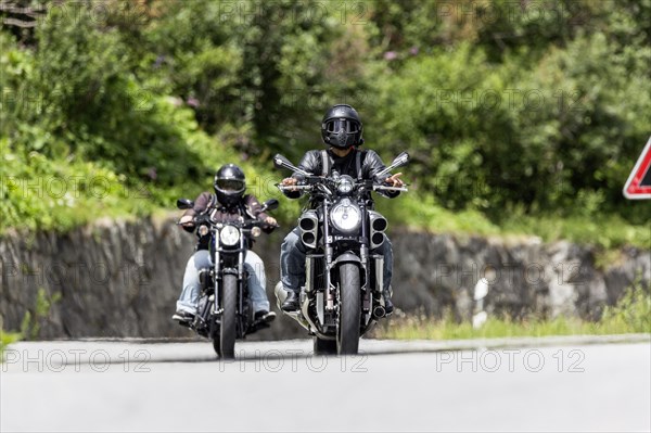 Motorbike on the winding Nufenen Pass in the Alps