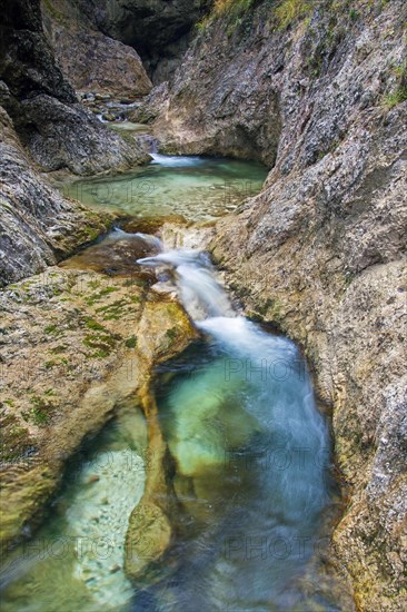 Waterfall in the river Almbach running through the Almbachklamm canyon in the Berchtesgaden Alps