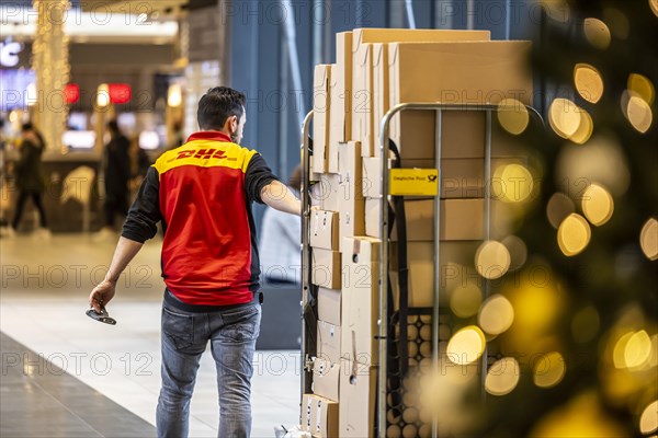 DHL parcel carrier with full trolley