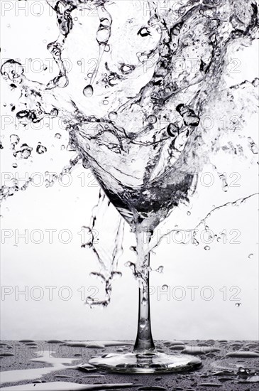 Studio shot of a water splashing on broken glass