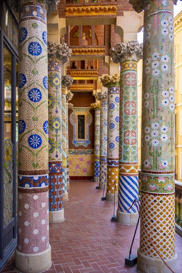 Columns with colourful mosaic on the outdoor terrace