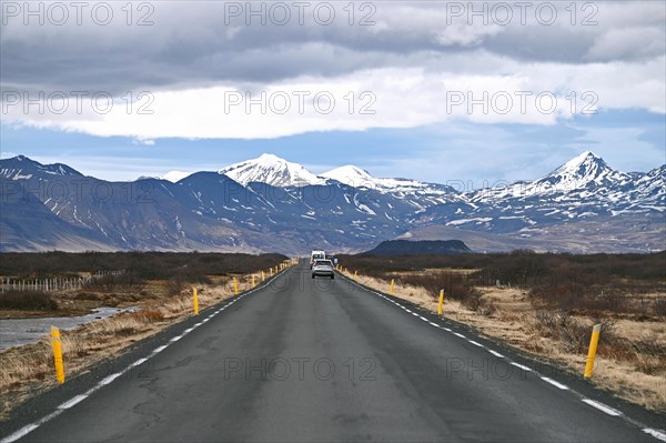 Road with view of snow-capped mountains on the Snaefellsnes peninsula in the west of Iceland