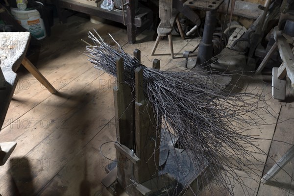 Broom-painting utensil of an old carpenter's workshop in an agricultural museum