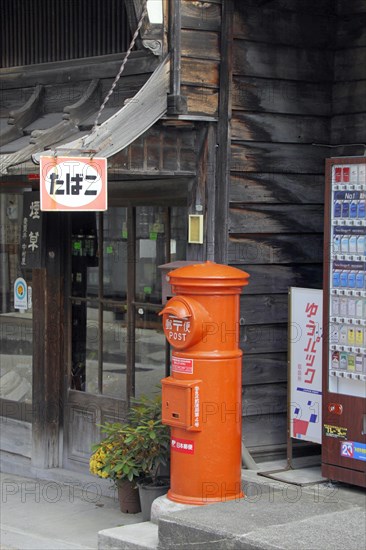 Post box in front of tobacconist at Narai-juku traditional small town in Nagano Japan