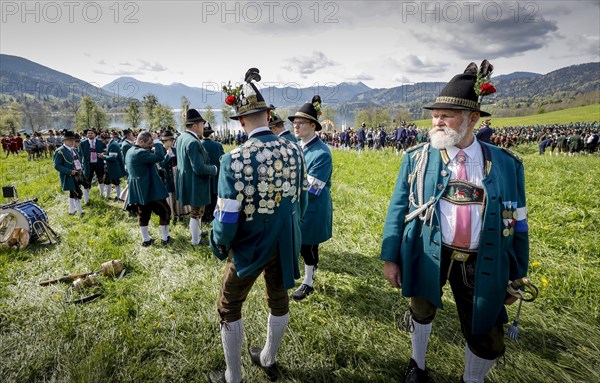 Mountain riflemen gather at the patron saint's day in a meadow near Gmund am Tegernsee