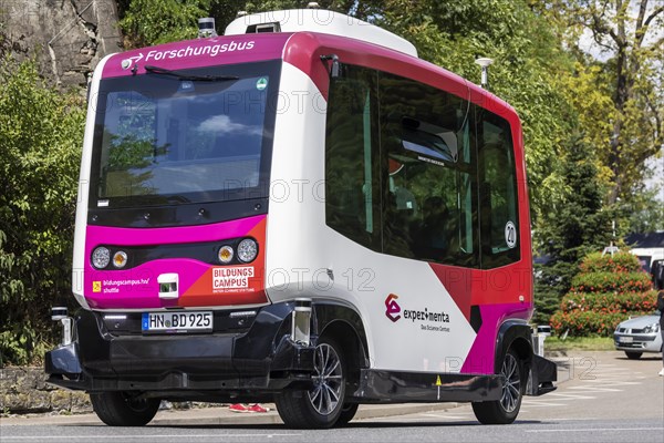 Autonomous minibus in front of the train station