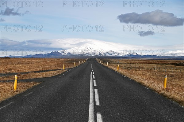 Road with view of snow-capped mountains in the south of Iceland