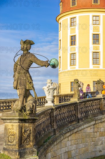 Baroque statue of a hunter with dog in front of the main entrance