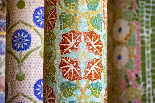 Columns with colourful mosaic on the outdoor terrace