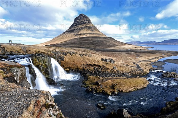 Kirkjufellsfoss waterfall and Kirkjufell mountain on the north coast of the Snaefellsnes peninsula in western Iceland