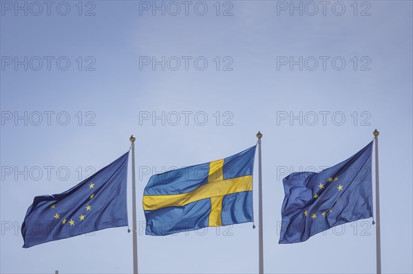 The Swedish flag as well as European flags flying in the wind at the Gymnich meeting in Stockholm