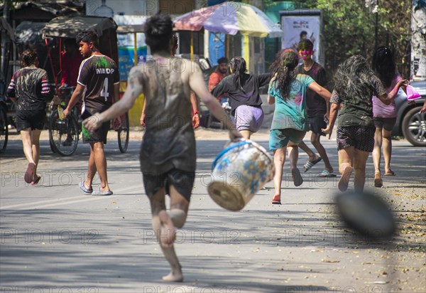 Revellers palying mud to celebrate Holi