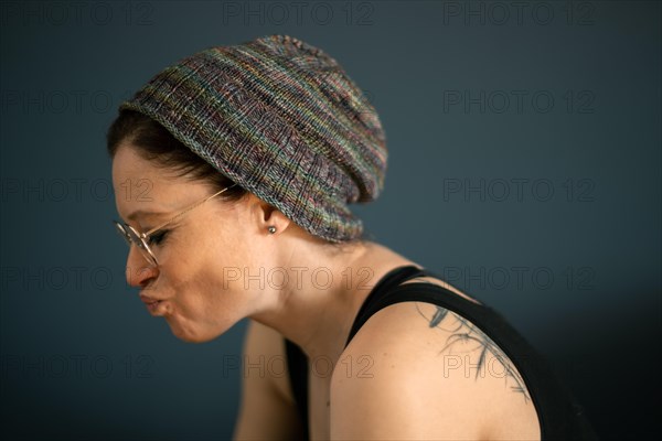 Woman with glasses and knitted cap