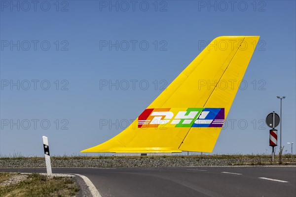 Tail fin of an aircraft in a roundabout of the DHL Air Hub