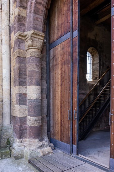 The entrance gate to the west tower of the Romanesque monastery ruins of St. Wigbert in Goellingen near Bad Frankenhausen in Kyffhaeuserland is open