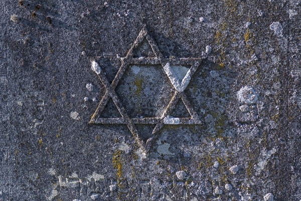Jewish star on an old gravestone