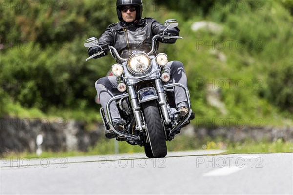 Motorbike on the winding Nufenen Pass in the Alps