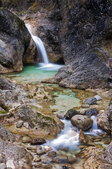 Waterfall in the river Almbach running through the Almbachklamm canyon in the Berchtesgaden Alps