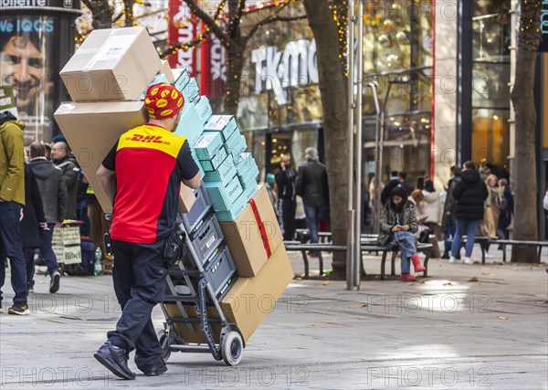 DHL parcel carrier with full trolley