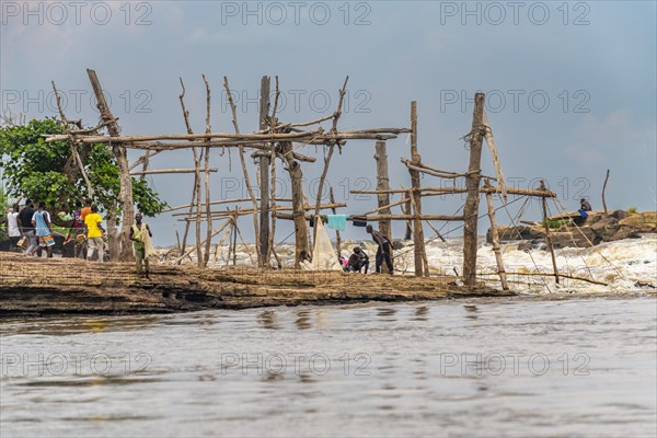 Wooden tripods with baskets attached