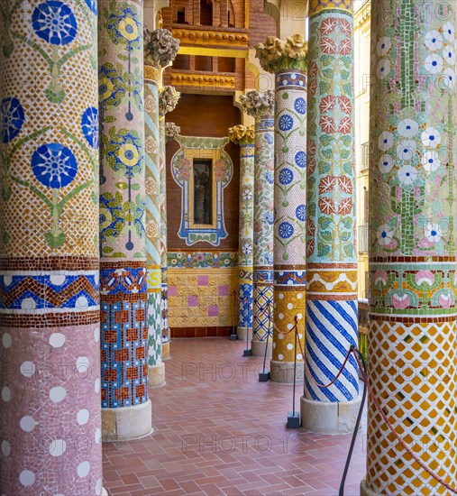 Columns with colourful mosaic on the outdoor terrace