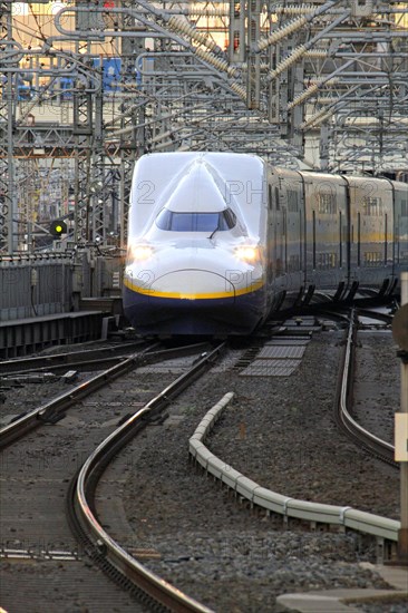 Shinkansen series E4 approaching Tokyo Station Asia