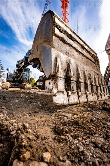 Excavator bucket of a Liebherr G922G8 on construction site