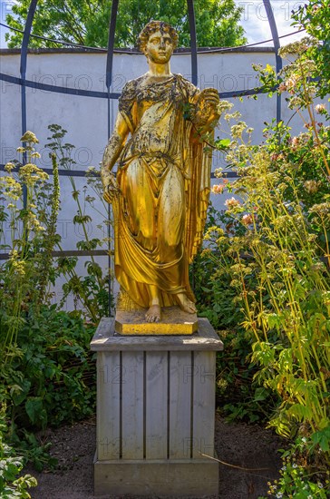 Golden statue under an arbour