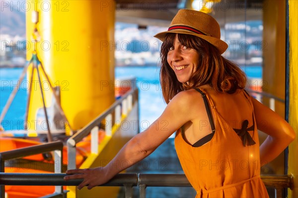 Tenerife ferry heading to Hierro or La Gomera from Los Cristianos. Tourist woman leaving the port