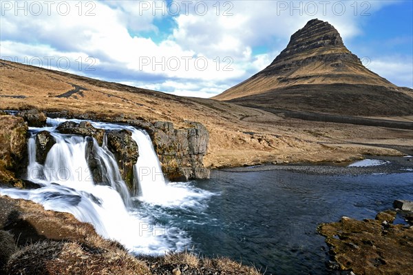 Kirkjufellsfoss waterfall and Kirkjufell mountain on the north coast of the Snaefellsnes peninsula in western Iceland