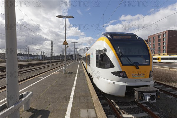 Eurobahn low-floor train stands at an empty platform