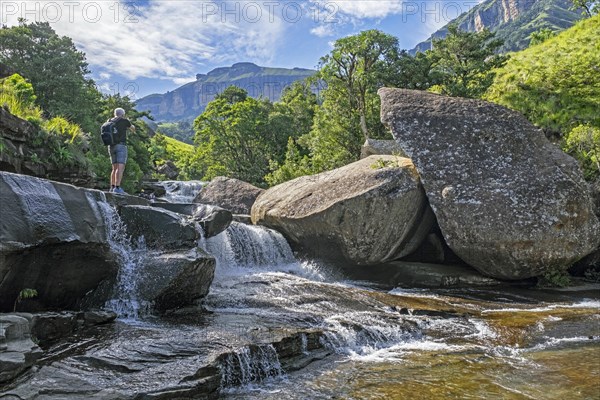 Western tourist visiting cascade in the Mahai River in the Royal Natal National Park