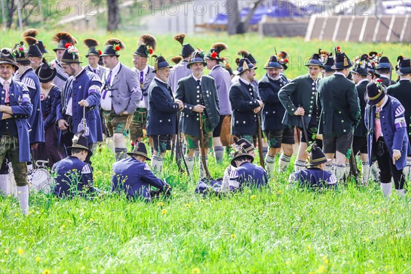 Mountain riflemen gather at the patron saint's day in a meadow near Gmund am Tegernsee