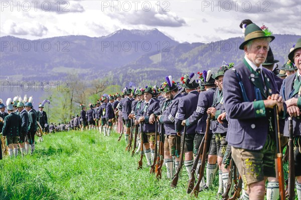 Mountain riflemen gather at the patron saint's day in a meadow near Gmund am Tegernsee