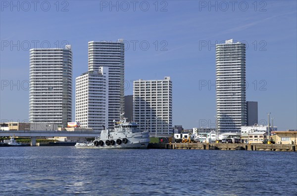 US Army Tugboat Lt-801 at Yokohama port Cotton Harbor skyscrapers in the background Kanagawa Japan Asia