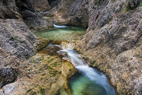 Waterfall in the river Almbach running through the Almbachklamm canyon in the Berchtesgaden Alps