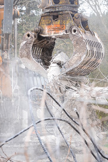 Excavator grab on demolition site