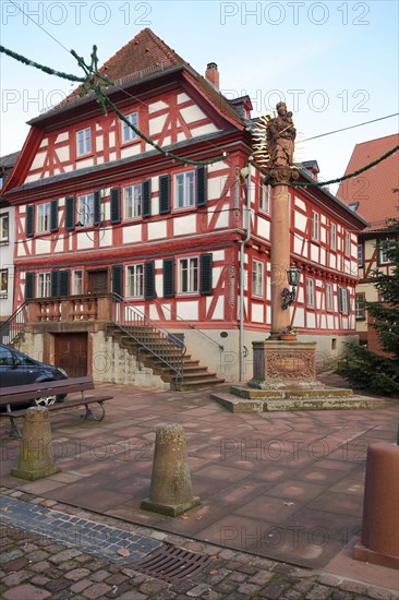 Market square with half-timbered house and fountain